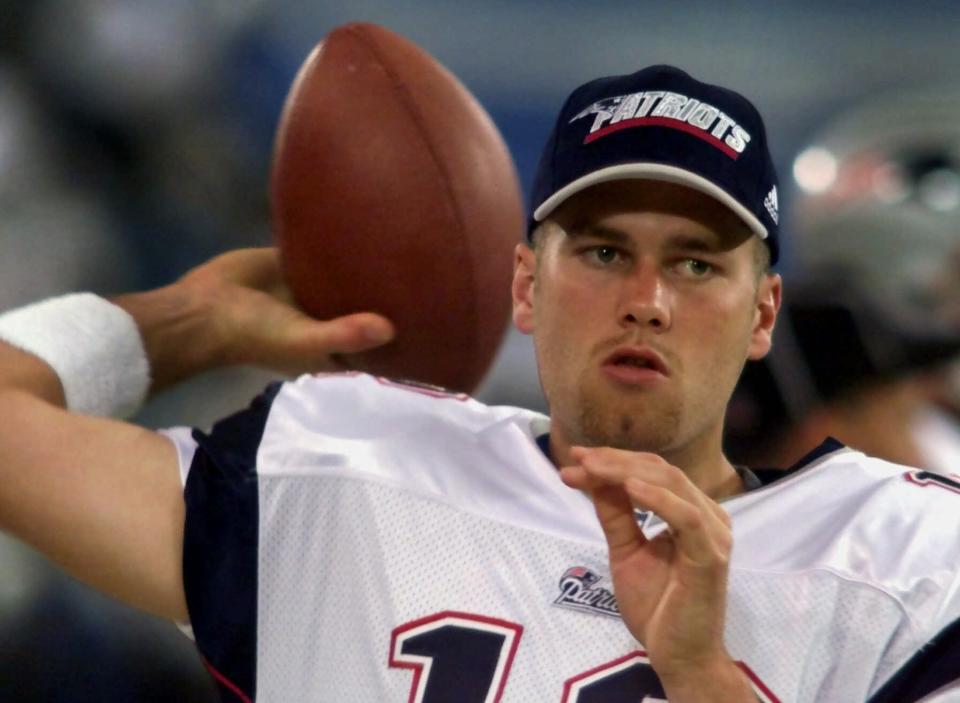 FILE - In this Aug. 4, 2000, file photo, New England Patriots backup quarterback Tom Brady warms up on the sidelines before an NFL football game against the Detroit Lions at the Silverdome in Pontiac, Mich. Brady grew from a sixth-round draft choice into one of the best quarterbacks in NFL history. On Tuesday, NFL commissioner Roger Goodell hears Brady's appeal of a four-game suspension for using deflated footballs in the AFC championship game. How will that affect Brady's legacy?  (AP Photo/Carlos Osorio, File)