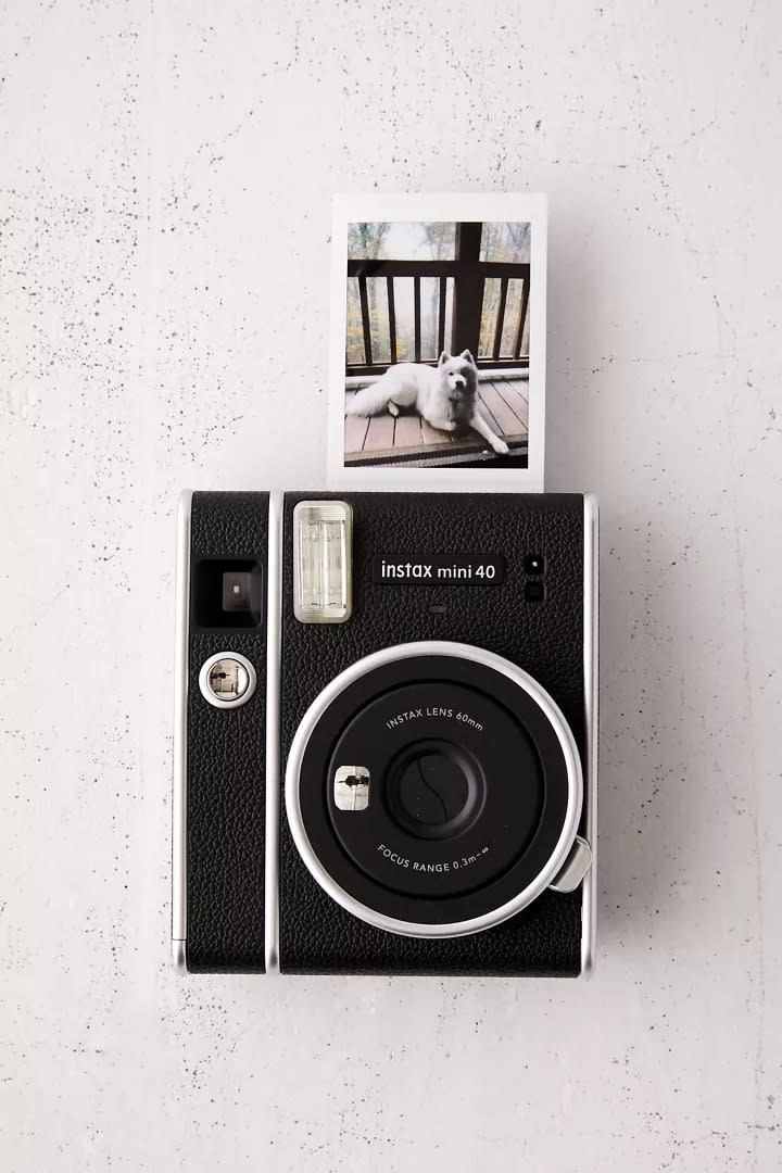 Fujifilm Instax Mini 40 Instant Camera releases an instant photo of a dog