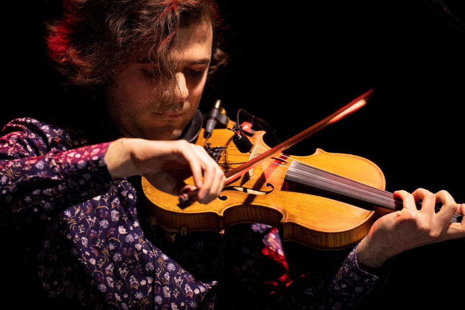 Alex Hargreaves plays fiddle with Billy Strings at Bridgestone Arena in Nashville, Tenn., Friday, Feb. 23, 2024.