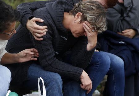 A family member of a trapped miner cries in front of the Raspotocje coal mine in Zenica, September 5, 2014. REUTERS/Dado Ruvic