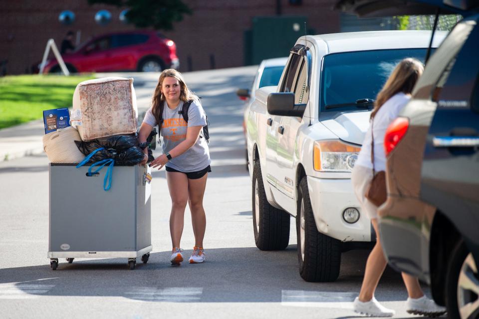 University of Tennessee students and their families unload and move belongings into Magnolia and Dogwood Halls during move-in day on Wednesday, August 16, 2023.