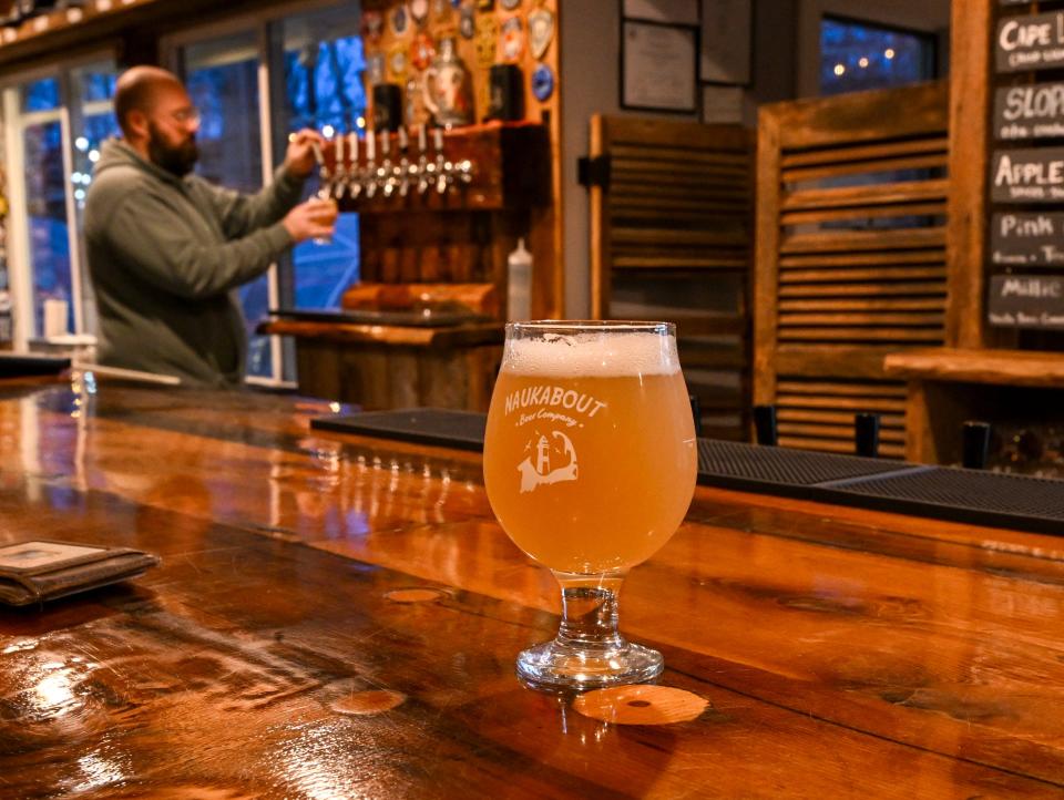 Craft beer is poured at Naukabout Brewing Co. in Mashpee.