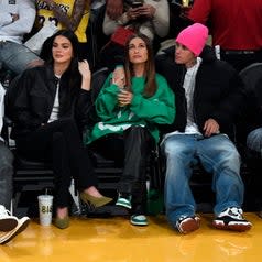 Kendall Jenner, Hailey Bieber, and Justin Bieber at a game