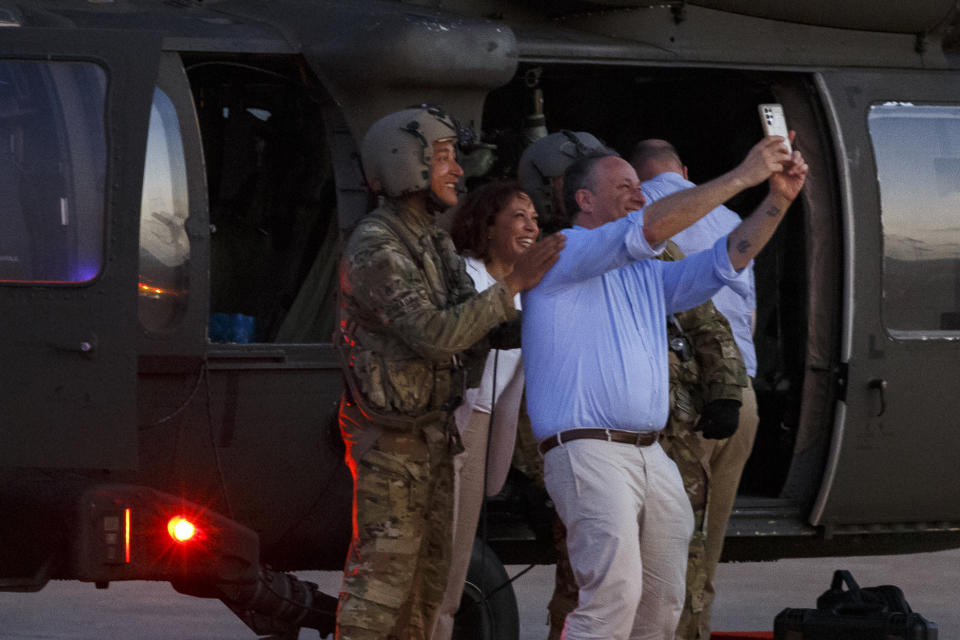 U.S. Vice President Kamala Harris and Second Gentleman Douglas Emhoff take a selfie after landing back in Accra following their tour of Cape Coast Castle in Ghana, Tuesday March 28, 2023. This castle in was one of around 40 "slave castles" that served as prisons and embarkation points for slaves en route to the Americas. Harris is on a seven-day African visit that will also take her to Tanzania and Zambia. (AP Photo/Misper Apawu, pool)