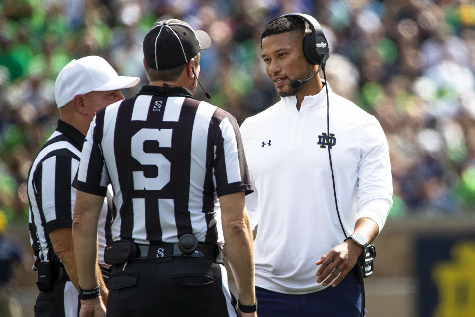 Notre Dame head coach Marcus Freeman talks with officials during the first half of an NCAA college football game against Central Michigan on Saturday, Sept. 16, 2023, in South Bend, Ind. (AP Photo/Michael Caterina)