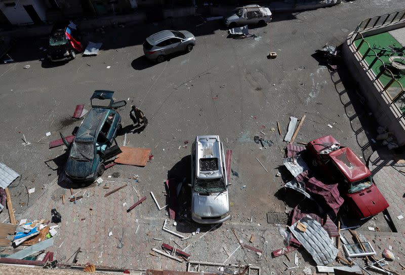 Damaged cars are seen on a street during the military conflict over the breakaway region of Nagorno-Karabakh, in Stepanakert