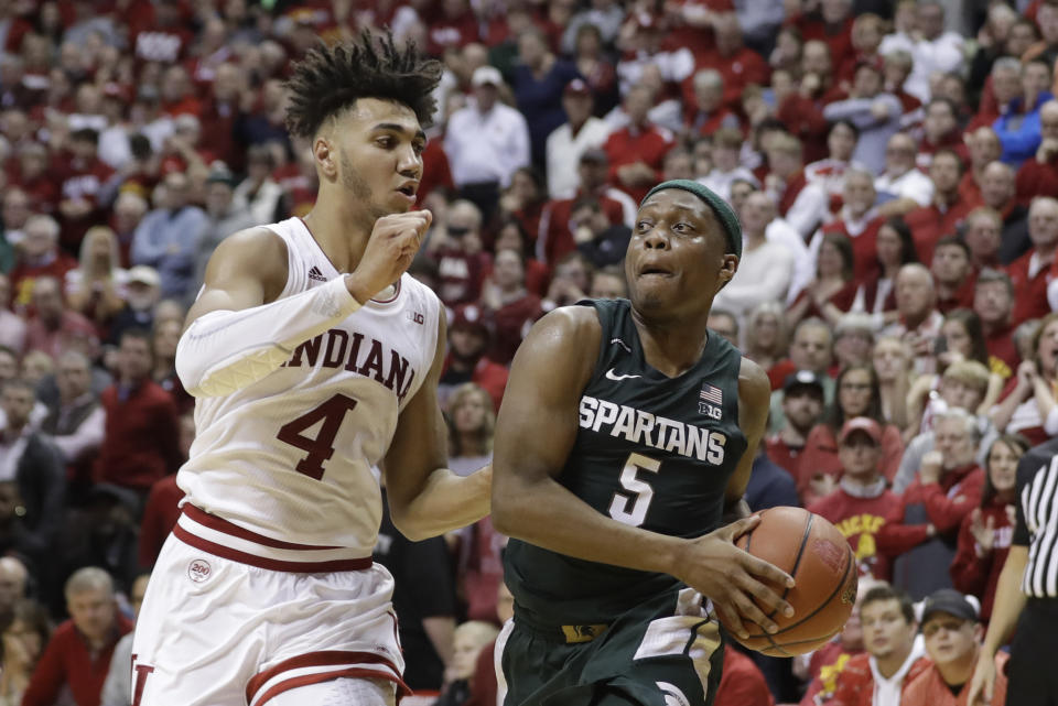 Michigan State's Cassius Winston (5) goes to the basket against Indiana's Trayce Jackson-Davis (4) during the second half of an NCAA college basketball game, Thursday, Jan. 23, 2020, in Bloomington, Ind. (AP Photo/Darron Cummings)