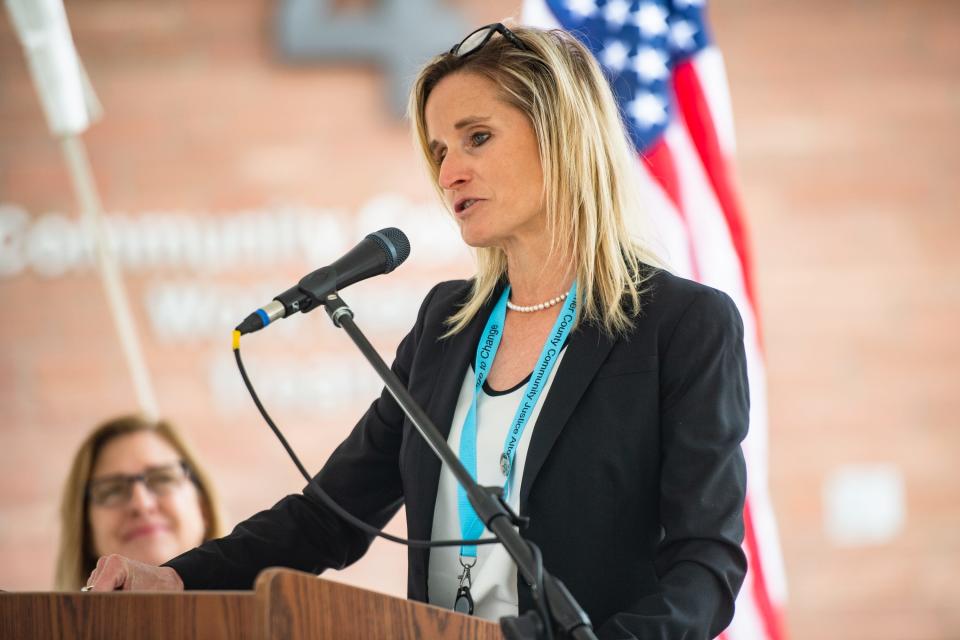 Community Justice Alternatives Director Emily Humphrey speaks during an opening ceremony for the Larimer County Community Justice Alternatives women's residential facility on Wednesday, May 24, 2023, in Fort Collins.