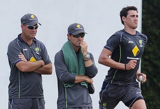 Australia's Mitchell Starc (R) delivers a ball as coach Mickey Arthur (L) and batting coach Justin Langer look on during an ICC Twenty20 Cricket World Cup practice session in Colombo, on September 26. Australia, South Africa, India and Pakistan, clubbed together for the Super Eights in the 'group of death', all came through unscathed by winning both their preliminary matches