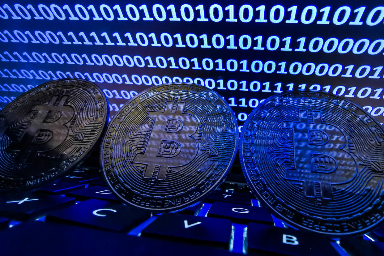 Representation of Bitcoin is seen with binary code displayed on a laptop screen in this illustration photo taken in Krakow, Poland on August 17, 2021. (Photo by Jakub Porzycki/NurPhoto via Getty Images)