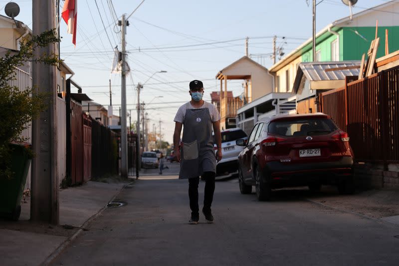 Pedro Campos bakes and sells homemade bread to his neighbours at Puente Alto area in the outskirt of Santiago