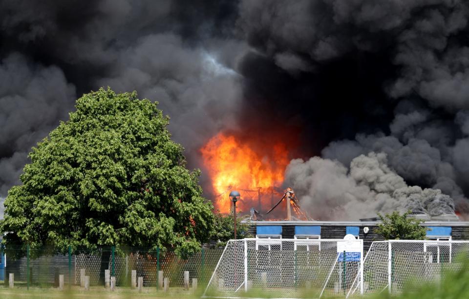 Plumes of smoke could be seen billowing out from the school (PA)