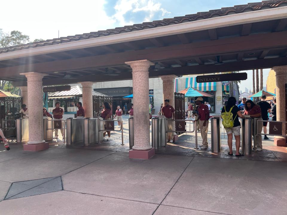 universal employees scanning tickets at the front of the theme park