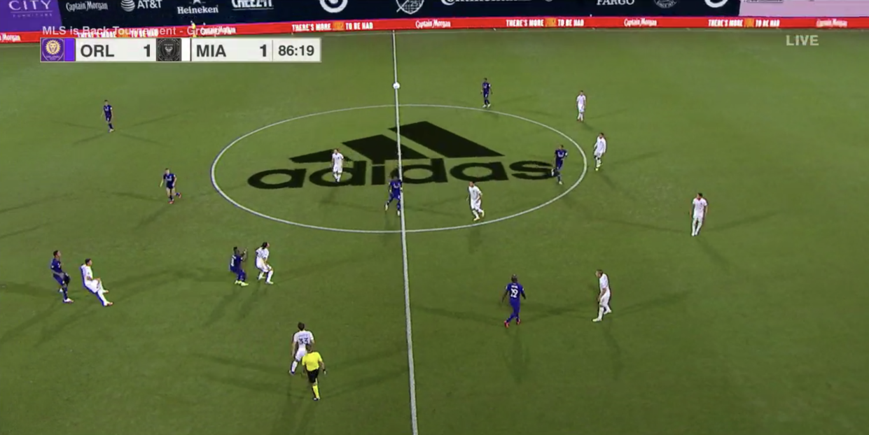 The first game of the MLS is Back Tournament had a giant Adidas logo superimposed in the center of the pitch on the ESPN broadcast. (Screenshot via ESPN)