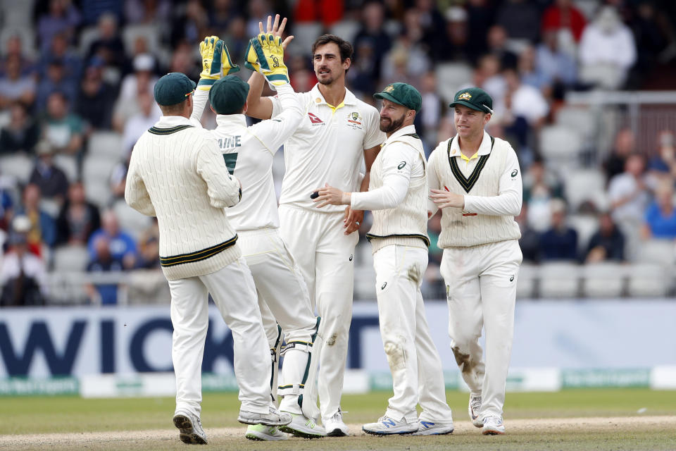 Australia's Mitchell Starc, centre, celebrates with teammates after dismissing England's Jonny Bairstow during day five of the fourth Ashes Test cricket match between England and Australia at Old Trafford in Manchester, England, Sunday Sept. 8, 2019. (AP Photo/Rui Vieira)