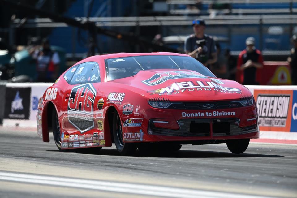 a red race car on a track