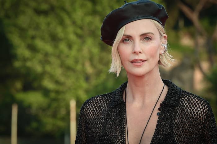 A closeup of Charlize Theron wearing a beret