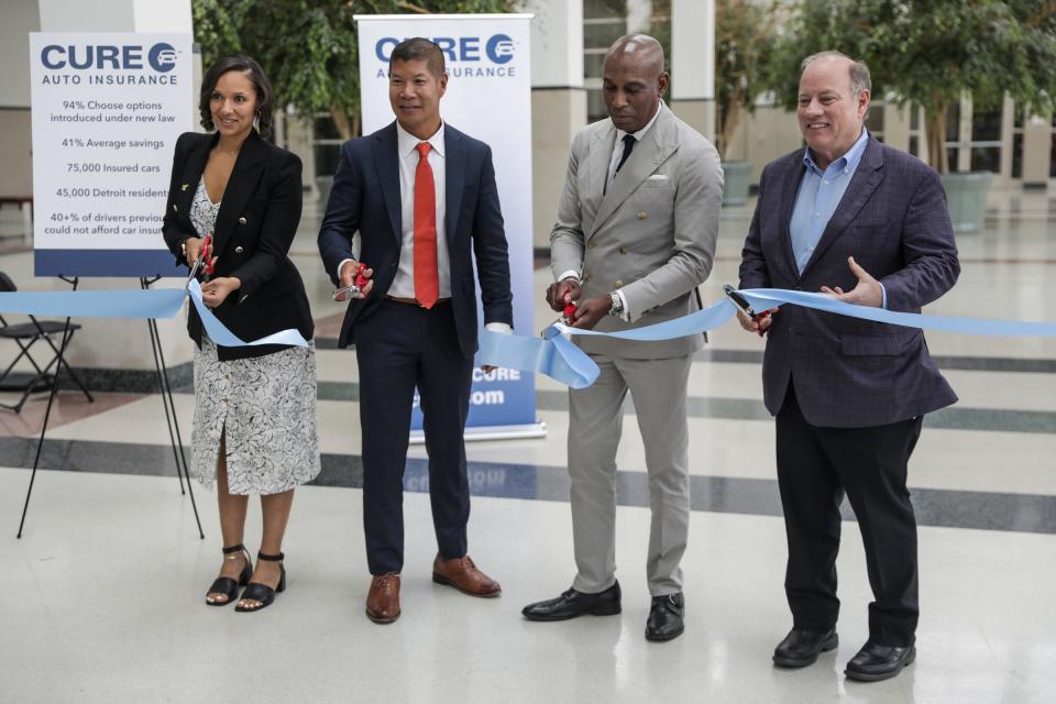 From left to right, Detroit City Council President Mary Sheffield, Cure Auto Insurance CEO Eric S. Poe, Detroit Economic Growth Corporation CEO Kevin Johnson and Detroit Mayor Mike Duggan cut the ribbon for the opening of the new CURE offices in Detroit on Wednesday, Aug. 30, 2023