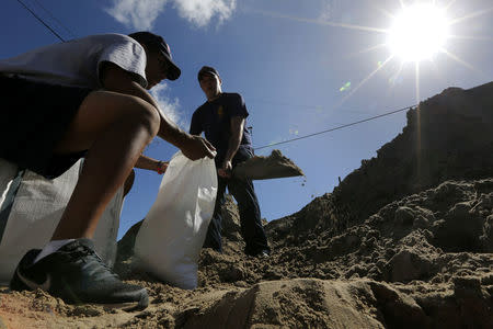 Members of the New Orleans Fire Department fill sandbags in preparation for Tropical Storm Nate in New Orleans, Louisiana, U.S., October 6, 2017. REUTERS/Jonathan Bachman