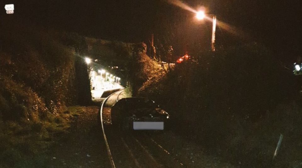 Car on railway line