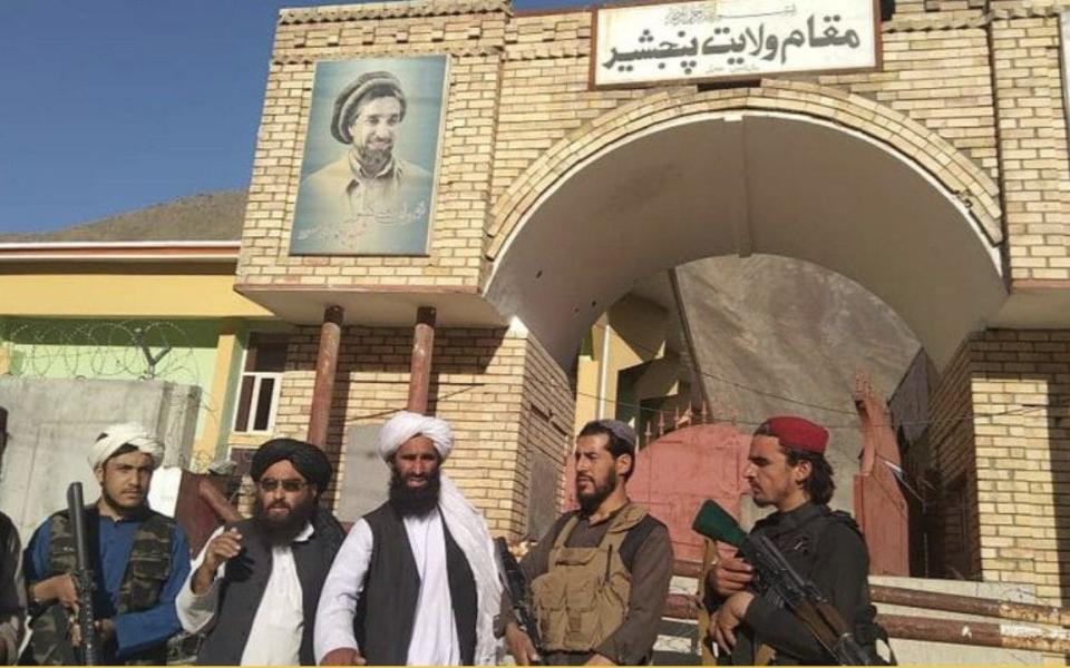 The Taliban outside the governor's office, a photo shared by the militants claims to show - SKY NEWS