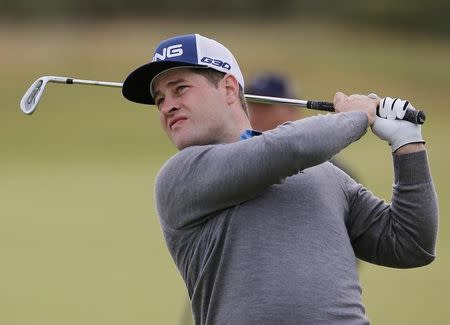 David Lingmerth of Sweden watches his tee shot on the tenth hole during the first round of the British Open golf championship on the Old Course in St. Andrews, Scotland, July 16, 2015. REUTERS/Paul Childs