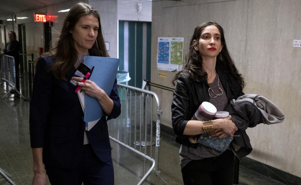 Elizabeth Entin, right, a witness in the Harvey Weinstein rape and sexual assault trial, walks towards the courtroom with Assistant District Attorney Meghan Hast Tuesday, Jan. 28, 2020 in New York. (AP Photo/Craig Ruttle)