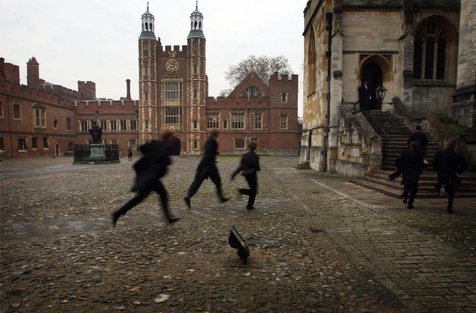 Boys run across the school yard of Eton College (Christopher Furlong/Getty Images)