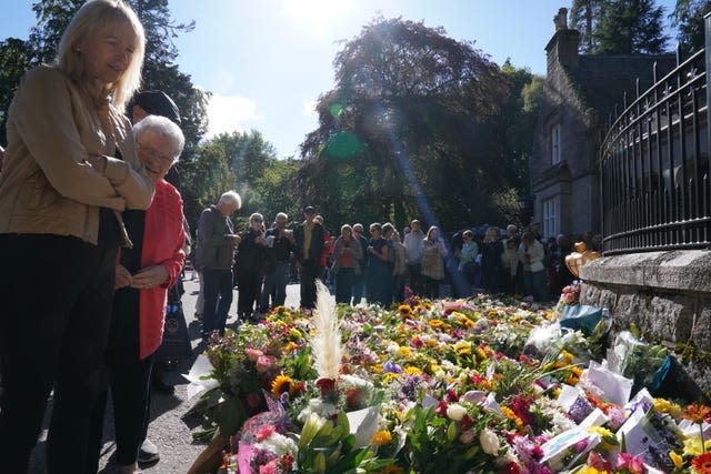 Well-wishers outside Balmoral in Scotland on Saturday following the death of the Queen 