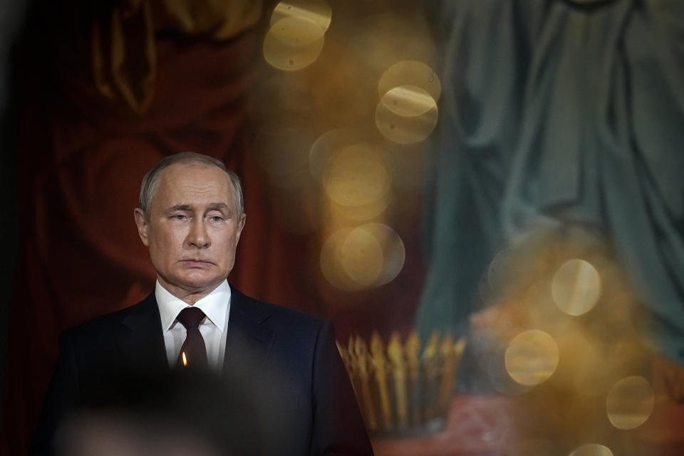 Russian President Vladimir Putin attends the Orthodox Easter service in the Christ the Savior Cathedral in Moscow, Russia, Sunday, April 24, 2022. Eastern Orthodox churches observe the ancient Julian calendar and this year celebrate the Orthodox Easter on April 24. (AP Photo/Alexander Zemlianichenko, Pool)