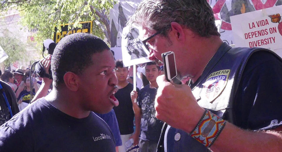 <p>Jarvis Johnson and “Bikers For Trump” founder Chris Cox argue outside of President Trump’s rally in Phoenix, Arizona on August 22, 2017. (Hunter Walker/Yahoo News) </p>