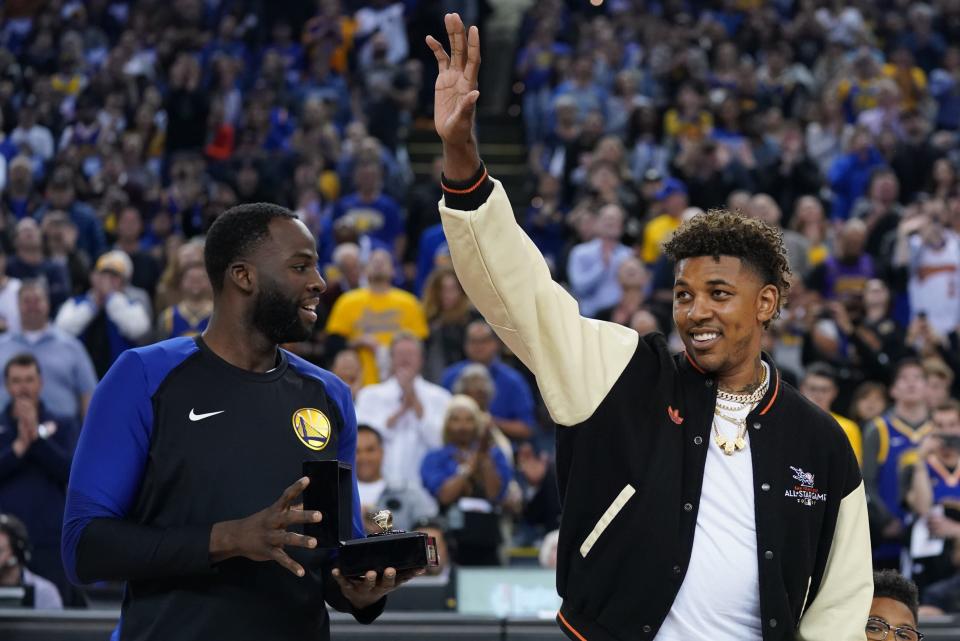 April 5, 2019; Oakland, CA, USA; Golden State Warriors former player Nick Young (right) receives his championship ring from forward Draymond Green (left) before the game against the Cleveland Cavaliers at Oracle Arena. Mandatory Credit: Kyle Terada-USA TODAY Sports