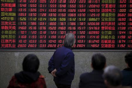 Investors look at an electronic board showing stock information at a brokerage house in Shanghai, China, March 7, 2016. REUTERS/Aly Song/File Photo