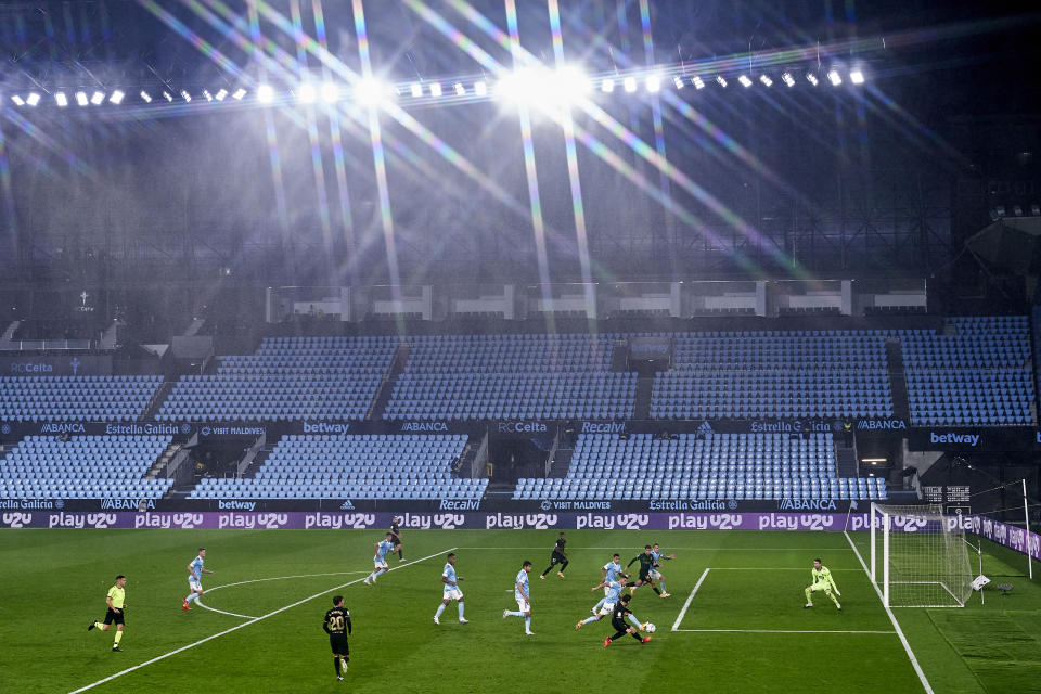 Lionel Messi shoots on goal and scores in an empty stadium.