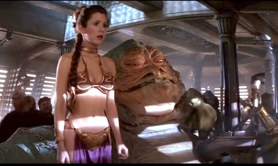 carrie standing next to jabba in the bikini