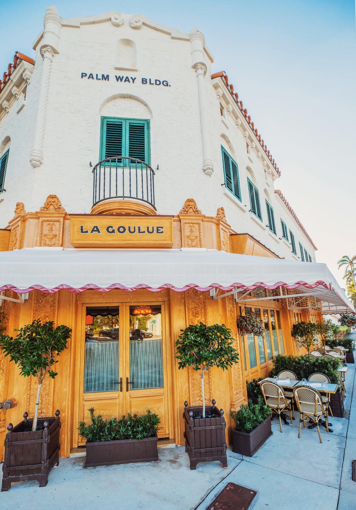 La Goulue, 288 S. County Road, now features outdoor tables along its north side flanking Royal Palm Way.