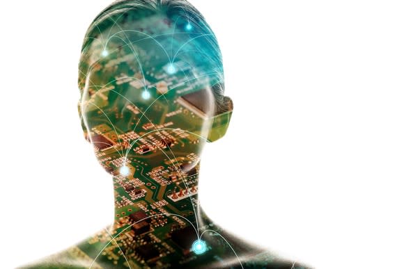 Silhouette of woman with computer motherboard projected on top of the image.