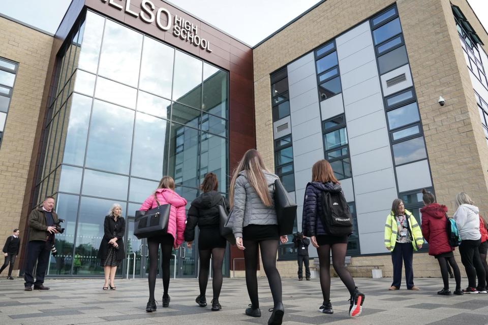 Pupils arrive at Kelso High School on the Scottish Borders as schools in Scotland start reopening: PA