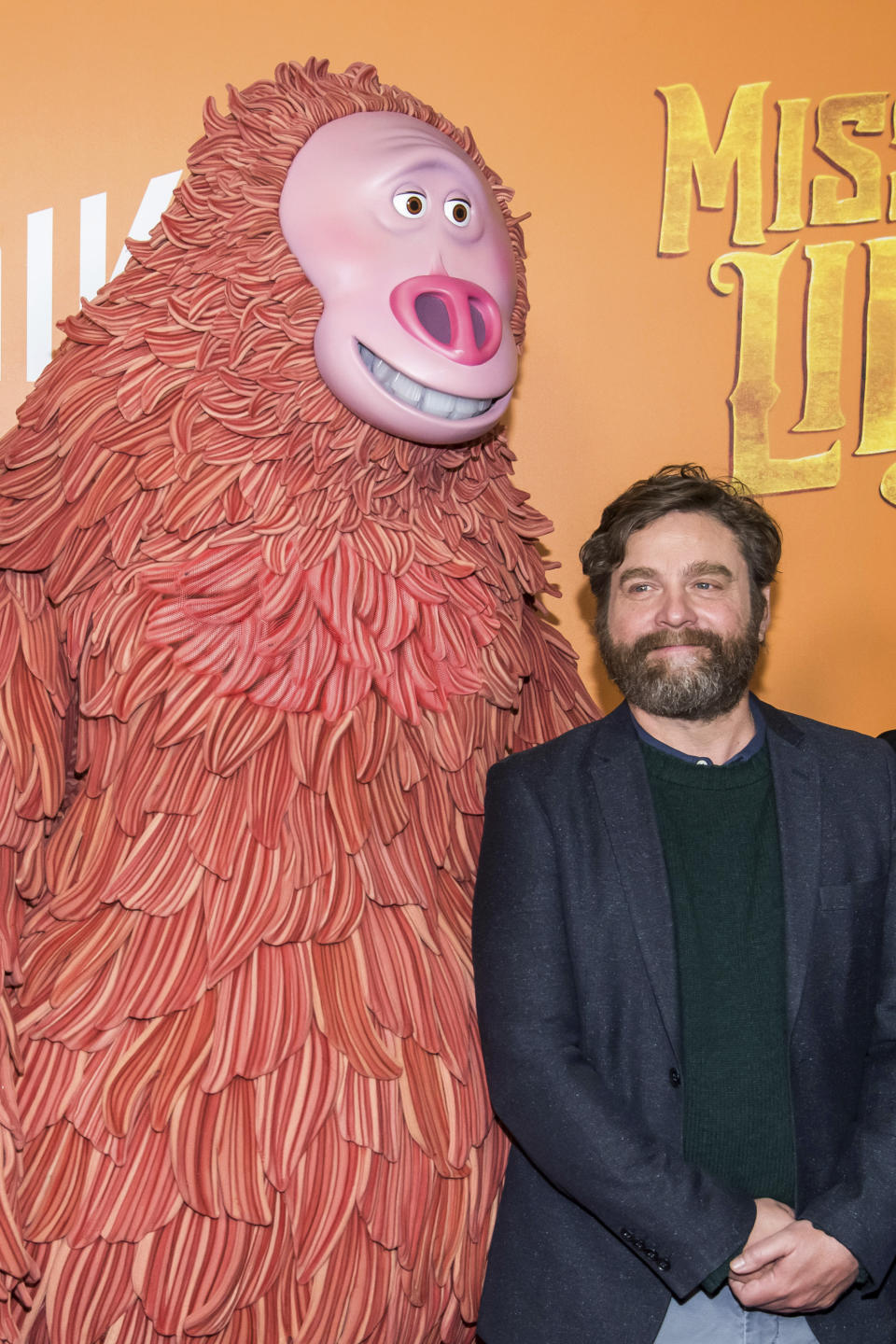 Zach Galifianakis poses with a costumed character from the film at the premiere of "Missing Link" at Regal Cinemas Battery Park on Sunday, April 7, 2019, in New York. (Photo by Charles Sykes/Invision/AP)