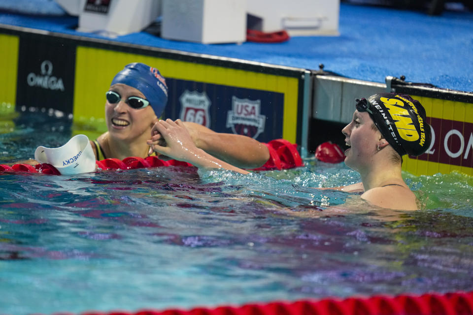 Claire Weinstein, right, celebrates with Katie Ledecky after winning the women's 200-meter freestyle event at the U.S. national championships swimming meet in Indianapolis, Wednesday, June 28, 2023. (AP Photo/Michael Conroy)