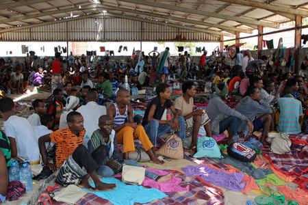 African migrants sit in a deportation center in Aden, Yemen March 17, 2018. Picture taken March 17, 2018. REUTERS/Fawaz Salman