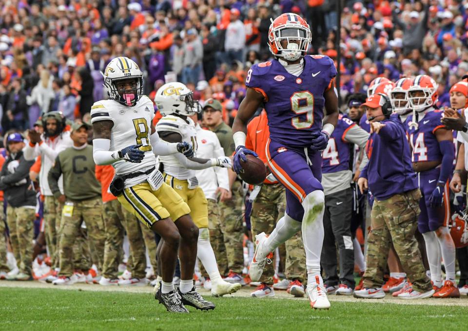 Clemson safety R.J. Mickens (9) runs with a ball near Georgia Tech receiver Malik Rutherford (8) during the third quarter Nov 11, 2023; Clemson, South Carolina, USA; at Memorial Stadium.