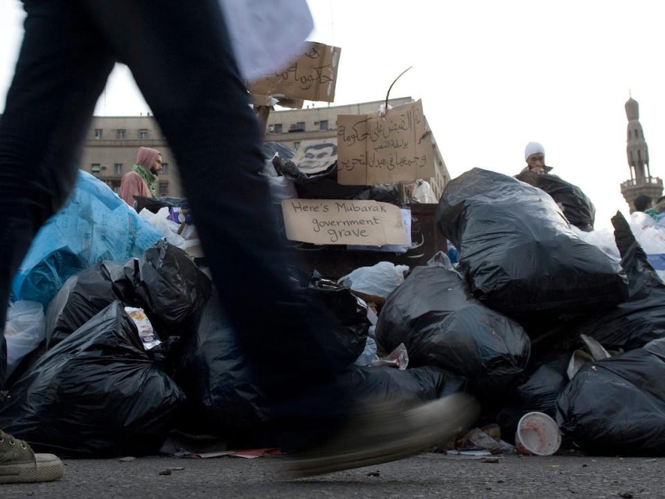 trash bags tahrir square mubarak's government egyptian revolution