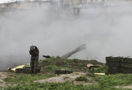 An Armenian serviceman of the self-defense army of Nagorno-Karabakh launch artillery toward Azeri forces in the town of Martakert in Nagorno-Karabakh region, which is controlled by separatist Armenians, April 3, 2016. REUTERS/Vahram Baghdasaryan/Photolure