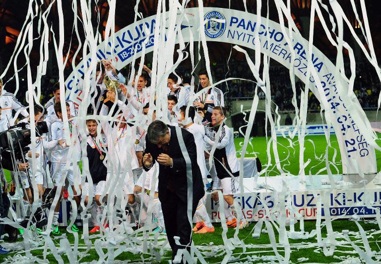 Hungarian Prime Minister Viktor Orban leaves the medal ceremony of the U17 International Easter Cup in the 'Pancho Stadium of Puskas Academy in Felcsut village, Hungary on April 21, 2014