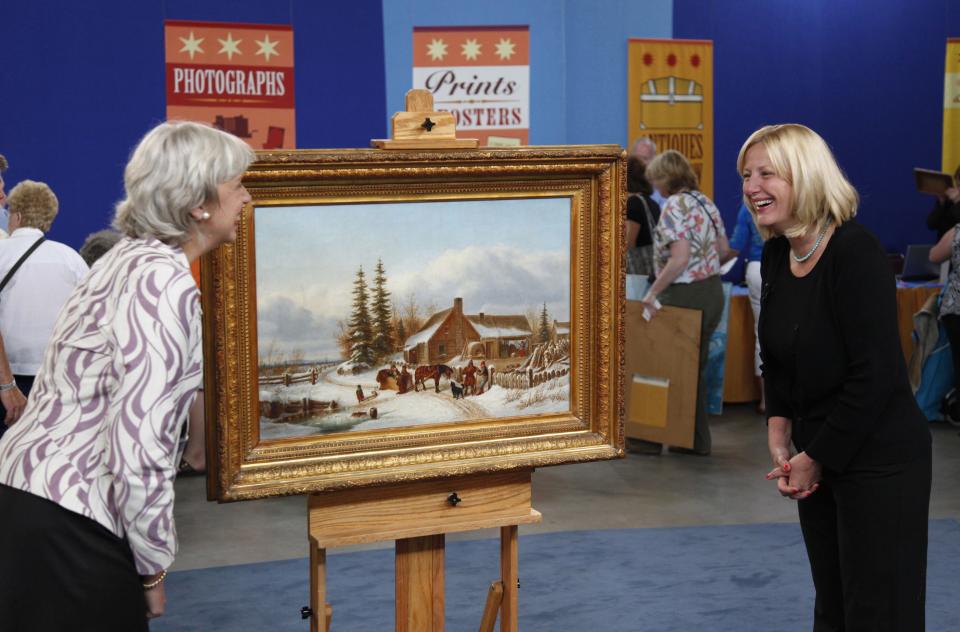 Appraiser Colleene Fesko reveals to the owner of this painting that it is valued in the $200,000 to $300,000 range.