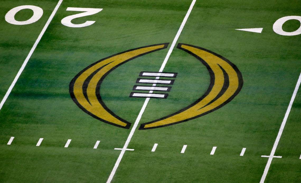 FILE - The College Football Playoff logo is shown on the field at AT&T Stadium before the Rose Bowl NCAA college football game between Notre Dame and Alabama in Arlington, Texas, Jan. 1, 2021. The College Football Playoff announced Thursday, Dec. 1, 2022, it will expand to a 12-team event, starting in 2024, finally completing an 18-month process that was fraught with delays and disagreements. The announcement comes a day after the Rose Bowl agreed to amend its contract for the 2024 and ’25 seasons, the last hurdle CFP officials needed cleared to triple the size of what is now a four-team format. (AP Photo/Roger Steinman, File)