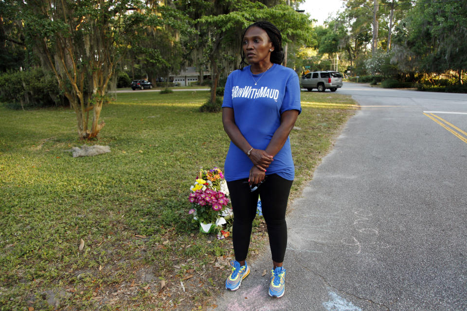 In this May 17, 2020, photo, Wanda Cooper-Jones stands near the spot where her 25-year-old son Ahmaud Arbery was shot and killed while jogging through a Brunswick, Ga., neighborhood. She says her son ran every day to clear his mind. (AP Photo/Sarah Blake Morgan)