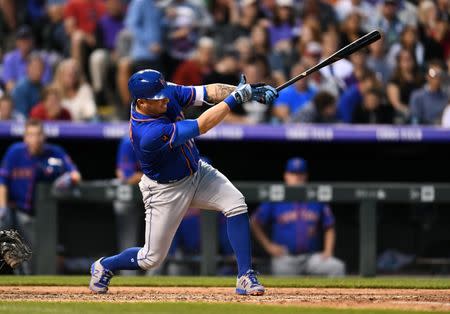 Jun 20, 2018; Denver, CO, USA; New York Mets second baseman Asdrubal Cabrera (13) hits a two run single in the fifth inning against the Colorado Rockies at Coors Field. Mandatory Credit: Ron Chenoy-USA TODAY Sports