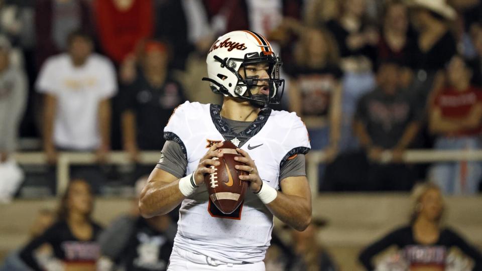 Oklahoma State's Spencer Sanders drops back to pass the ball.